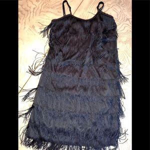 Children’s fringed black dress.